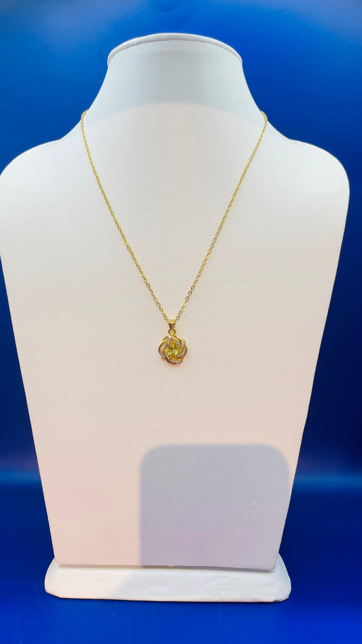 Our "Zuhi'' Gold with Topaz Pendent
