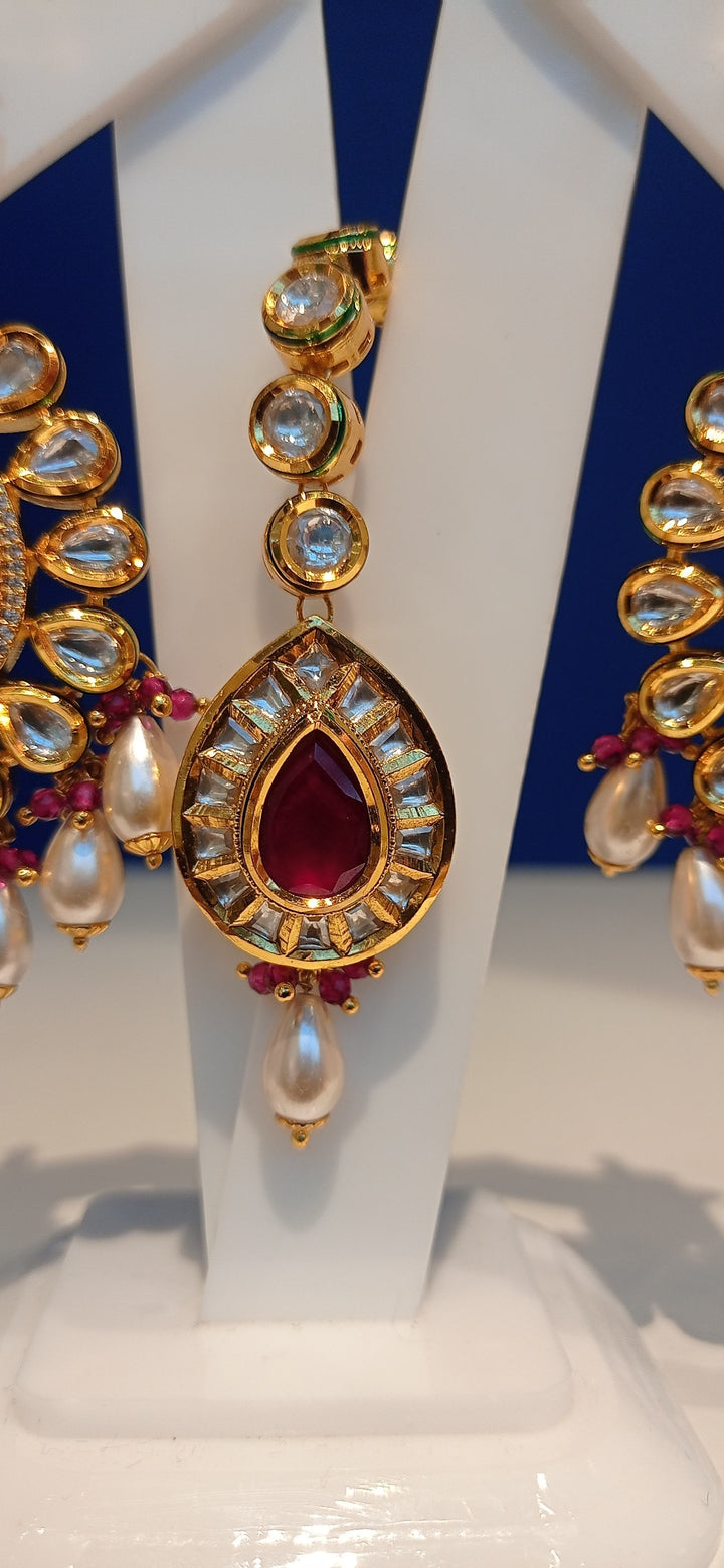 Simina Imitation Ruby and Polki Diamond Kundan Necklace, Earrings and Teeka Bridal Jewellery Set