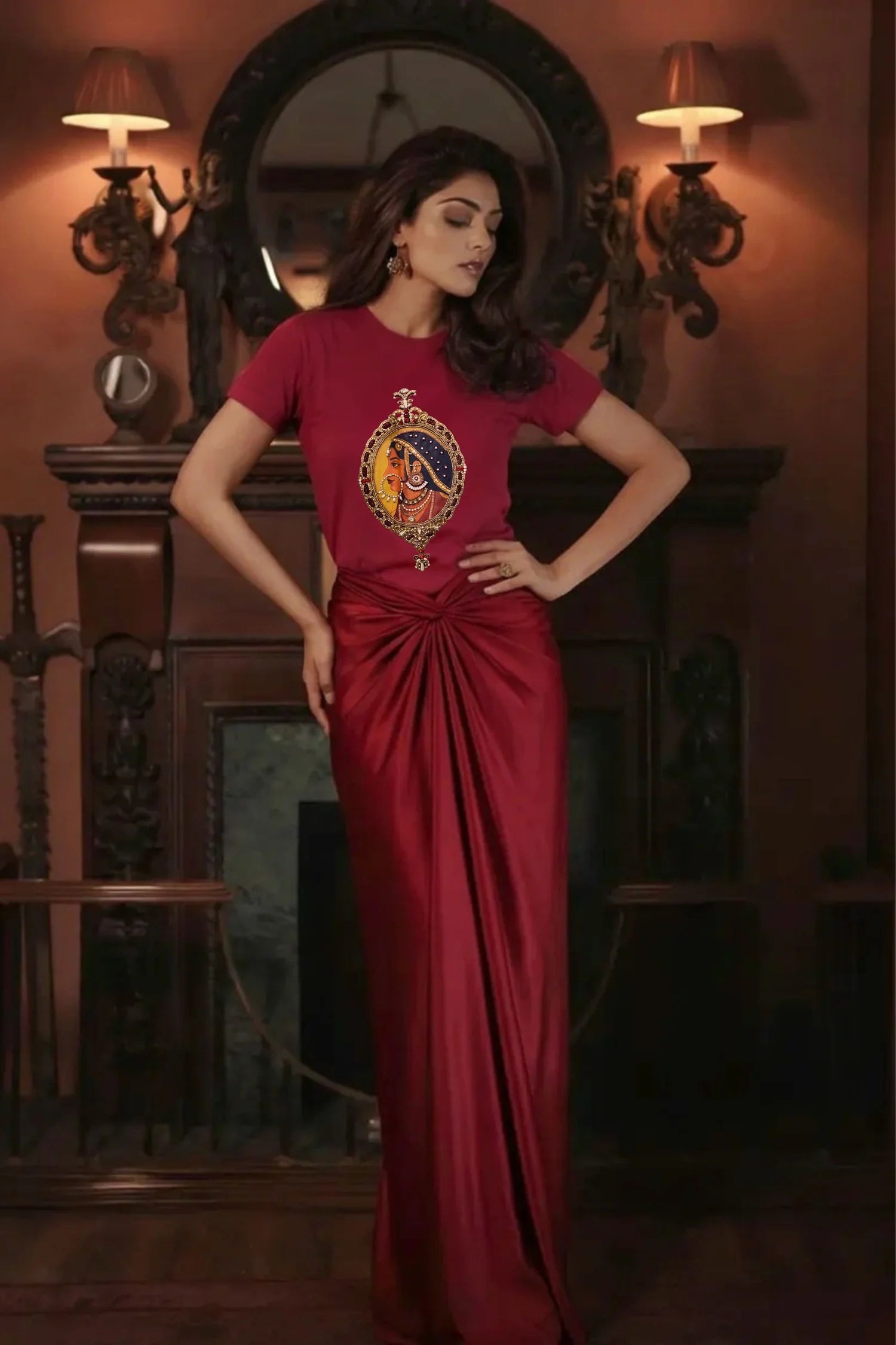 Woman in a red dress with a decorative emblem in an ornate room.