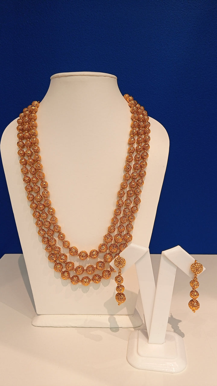 Mrinalina Three-strand Gold Beaded Necklace and Earrings Set