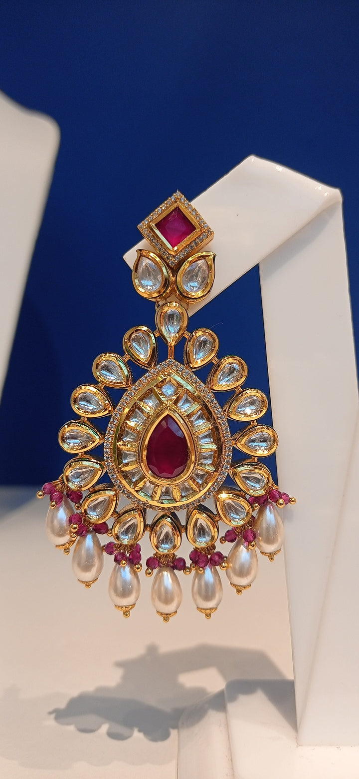 Simina Imitation Ruby and Polki Diamond Kundan Necklace, Earrings and Teeka Set