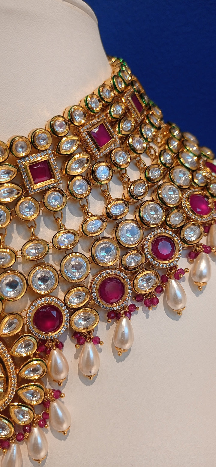 Simina Imitation Ruby and Polki Diamond Kundan Necklace, Earrings and Teeka Set